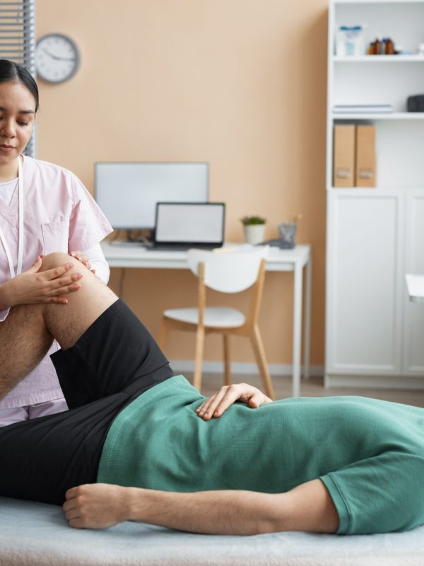 doctor-helping-patient-rehabilitation (1)