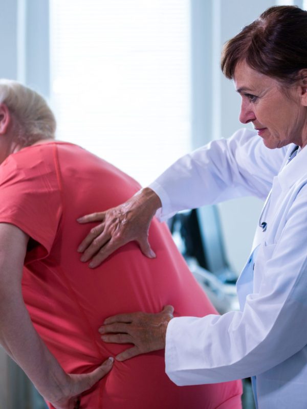 Female doctor examining a patient at the hospital
